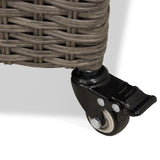 A black caster wheel attached to a wicker basket, enabling mobility, against a light background.