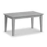 A grey wooden table stands centered against a plain white background, with no visible objects on or around it.