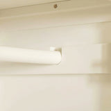 A white roller blind is partially rolled up against a beige wall, near a ceiling with a visible screw.