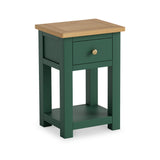 A green wooden nightstand with a single drawer and a lower shelf, against a white background. The drawer has a round, brass knob.