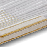 A close-up of a filter showing pleated white fibrous material and a yellowed edge on a white background.