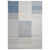 A patterned rug with alternating horizontal blue and grey stripes of varying thickness against a white background lies flat. There's no text present.