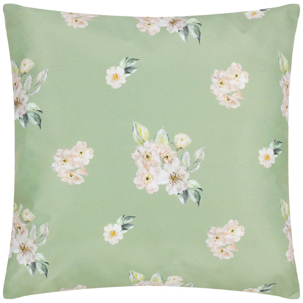 A square green cushion with a floral pattern consisting of pink and white flowers with green leaves. It appears soft and decorative, typically used for home furnishing.