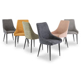 Five modern chairs with fabric upholstery in varied colors (grey, orange, olive, pink, charcoal), arranged in an arc, isolated on a white background.