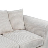 A beige corduroy couch with plush cushions against a white background.