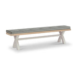 A cushioned wooden bench with white crisscross legs, shown stationary against a plain white background.