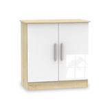 A wooden cabinet with white doors and silver handles stands stationary against a white background. The top and base have a natural wood finish.