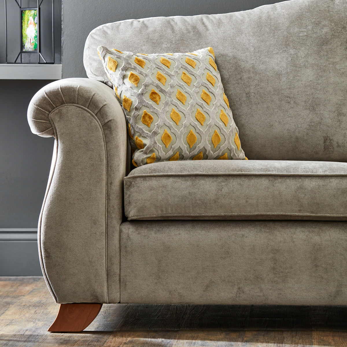 Ashwood-armchair-ochre-orange-cushions-grey from Roseland Furniture