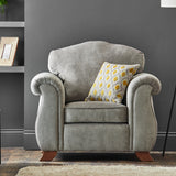 Ashwood-armchair-ochre-orange-cushions-grey from Roseland Furniture