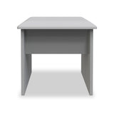 A simple gray desk with a flat top and four legs is centered against a white background. The desk has a minimalist design.