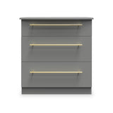 A grey three-drawer chest with horizontal gold handles centered on each drawer, against a plain neutral background.