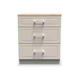 A three-drawer wooden filing cabinet with silver handles stands isolated against a white background.