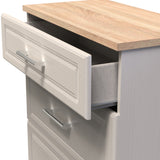 A partially open drawer reveals a fabric-lined interior in a gray, wooden filing cabinet, against a non-descript background.