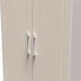 A closed double-door cabinet with vertical handles set against a bland background. The focus is on the simplicity and functionality of the furniture design.