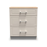 A three-drawer filing cabinet, with a beige wood top and silver handles, stands against an isolated white background.