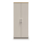 A beige double-door wardrobe stands closed against a plain white background. The doors have vertical paneling and metallic handles.