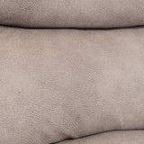 Folded beige fabric with a textured surface, closely stacked, likely soft to the touch, against a plain backdrop.