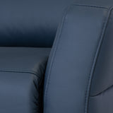 A close-up of a dark blue leather sofa, showing texture and stitching; no visible action; indoors with subdued lighting. No text present.