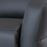 A close-up of a black leather chair with visible stitching details on a simple, unadorned backdrop.