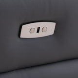 A metallic, rectangular latch with two circular holes and a slot is affixed to a textured, dark leather surface, suggesting the interior of an upscale vehicle or furniture.