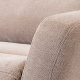 Beige upholstered sofa, textured fabric, no visible action, indoor setting.