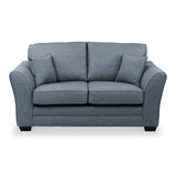 A blue two-seat fabric sofa with cushioned arms and backrest, isolated on a white background.