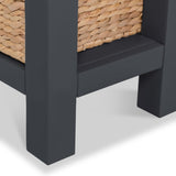 A woven basket sits atop a black shelf with a sturdy leg visible, against a white background.