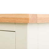 A wooden table edge with a bandage applied over a crack, set against a white background depicting a concept of repair or care.