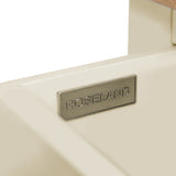 A metal nameplate with the inscription "ROSELAND" is mounted on a cream-colored surface, possibly furniture.