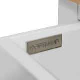 A metal nameplate with the inscription "ROSELAND" is affixed to a white surface, likely furniture, near a light-colored wooden element.