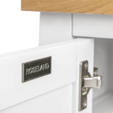 A metal drawer handle with the inscription "ROSELAND" attached to a white drawer front beneath a wooden countertop, with focus on the handle.