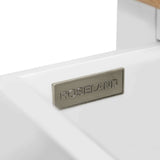 A metal plaque with the word "ROSELAND" is affixed to a white surface, set against a minimalist background, suggesting a branding or location sign.