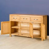 Abbey Light Oak Large Sideboard - Lifestyle Side view with cupboard doors open