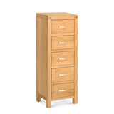 A vertical wooden filing cabinet with five drawers and silver handles stands isolated against a white background.