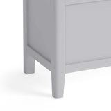 close up of tapered legs on the Elgin Grey Blanket Box