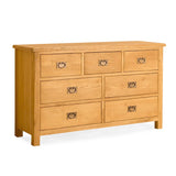 A wooden dresser with six drawers, featuring metal handles, is isolated against a white background.