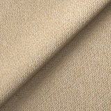 Textured fabric with a diagonal fold, displaying woven beige and light brown threads in a close-up view.