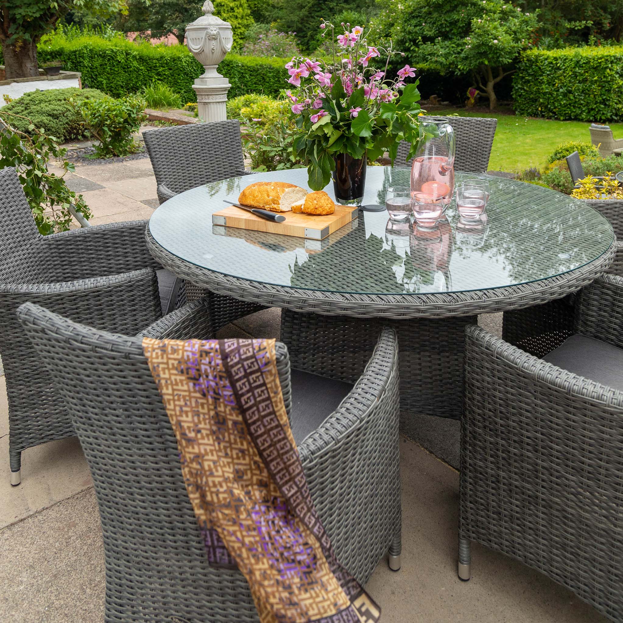 Round dining table with wicker online chairs