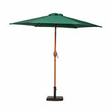 A large green patio umbrella stands open, mounted on a brown pole with a black base, set against a white background.