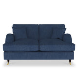 A denim blue upholstered sofa with two cushions stands against a white background, featuring dark wooden legs with golden caster wheels.