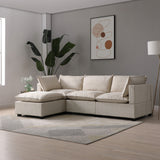 Beige sectional sofa with cushions rests on a striped rug in a modern living room, flanked by a large potted plant and abstract wall art.