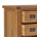 A wooden desk with two visible drawers featuring metal handles, on an isolated white background.