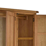 Zelah Oak Triple Wardrobe with Drawers - Close up of hanging rail fixing