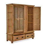 A wooden wardrobe stands open, displaying its empty shelves and drawers, isolated against a plain background.