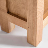 close up of rustic oak legs on Surrey Oak Slim Bookcase