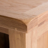 close up of oak top corner on the Surrey Oak Slim Bookcase