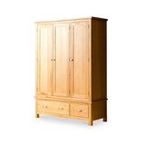 A wooden wardrobe with three doors and two drawers stands isolated against a white background.