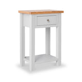 A white wooden side table with a natural wood top and a single drawer, standing against a plain white background.