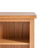 A wooden side table with a flat top and an open shelf, isolated against a white background.