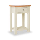 A cream-colored wooden side table with a natural wood top and a single drawer, against a white background.